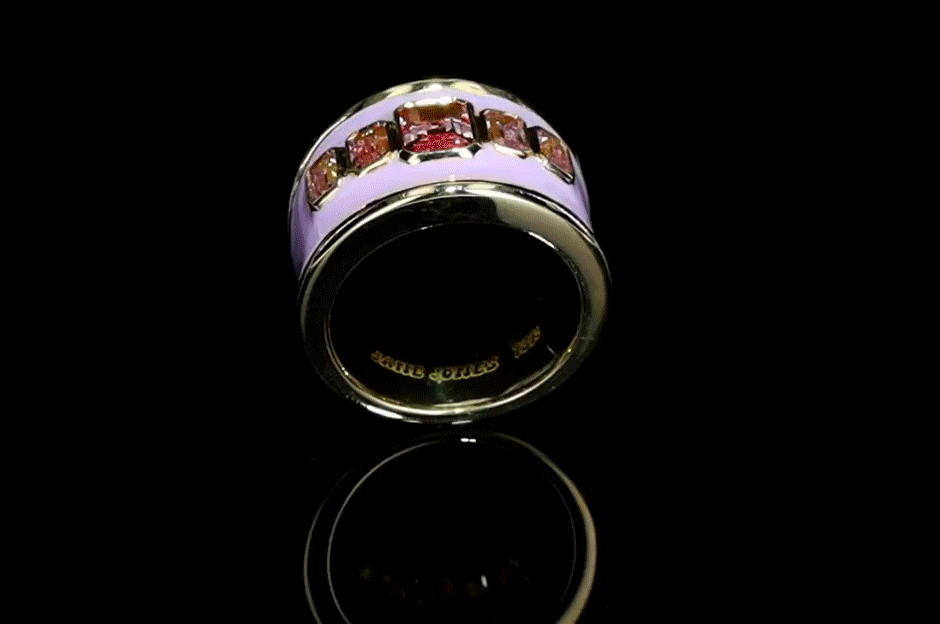 18ct yellow gold ring with pink enamel and emerald cut lab-grown pink sapphires, set on a tapered band.