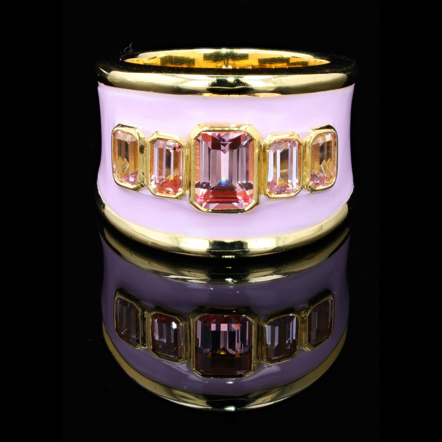 18ct yellow gold ring with pink enamel and emerald cut lab-grown pink sapphires, set on a tapered band.