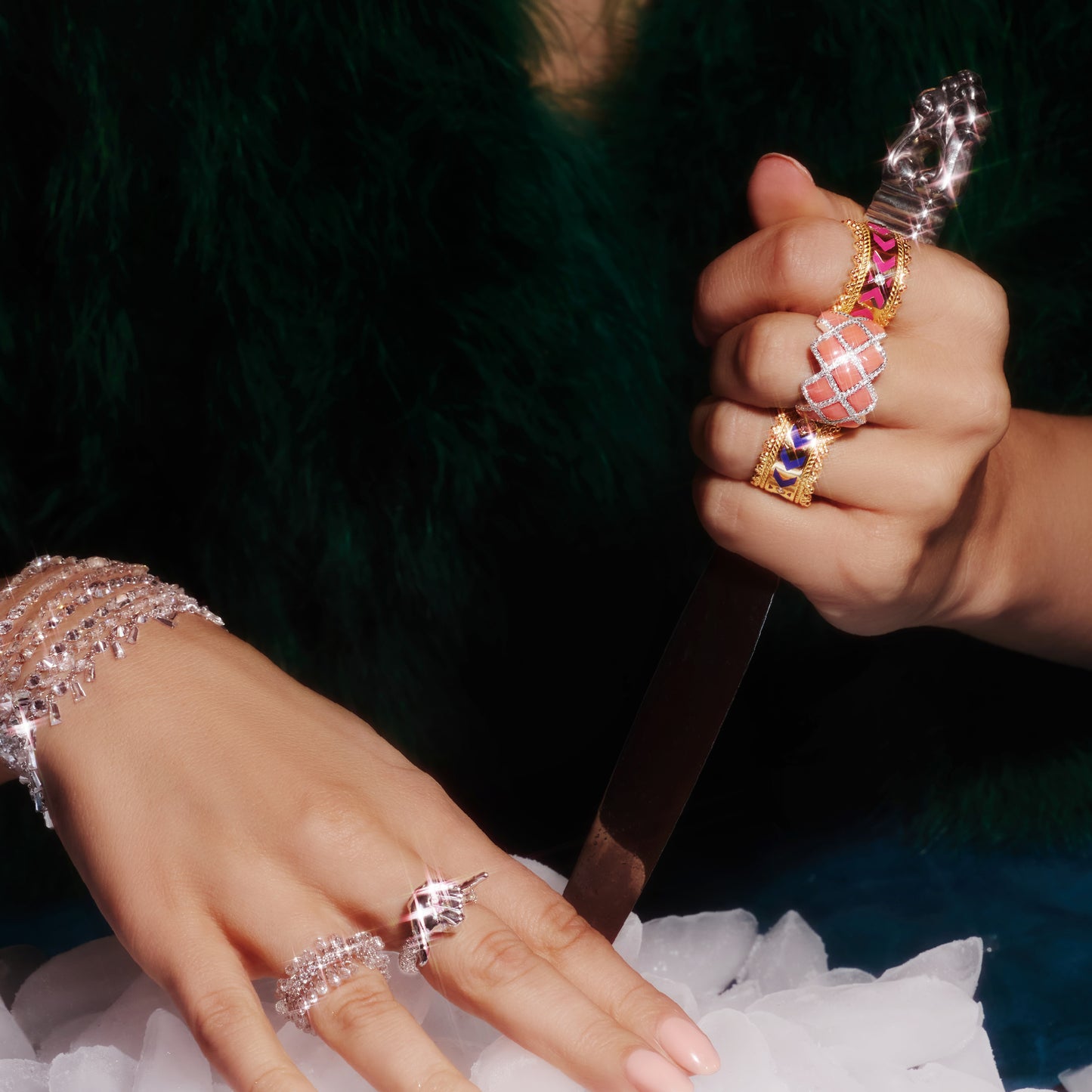 Venezia ring in 18ct yellow gold with pink enamel and lab-grown diamonds, worn on a hand with other rings.